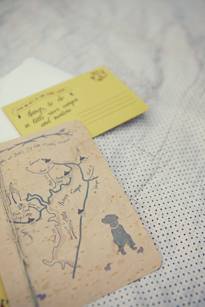Leigha and Kile’s wedding invitation suite featuring a hand-drawn map of the area and their beloved black lab, Daisy.