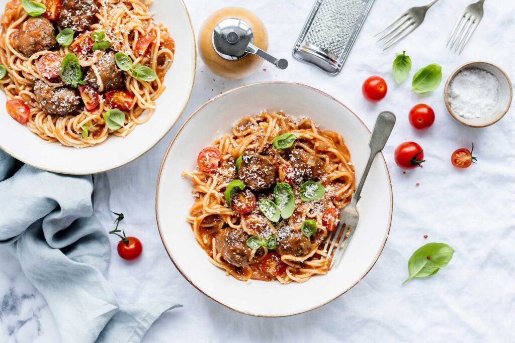 Close-up of a plate of spaghetti and meatballs, inspired by Lady and the Tramp.